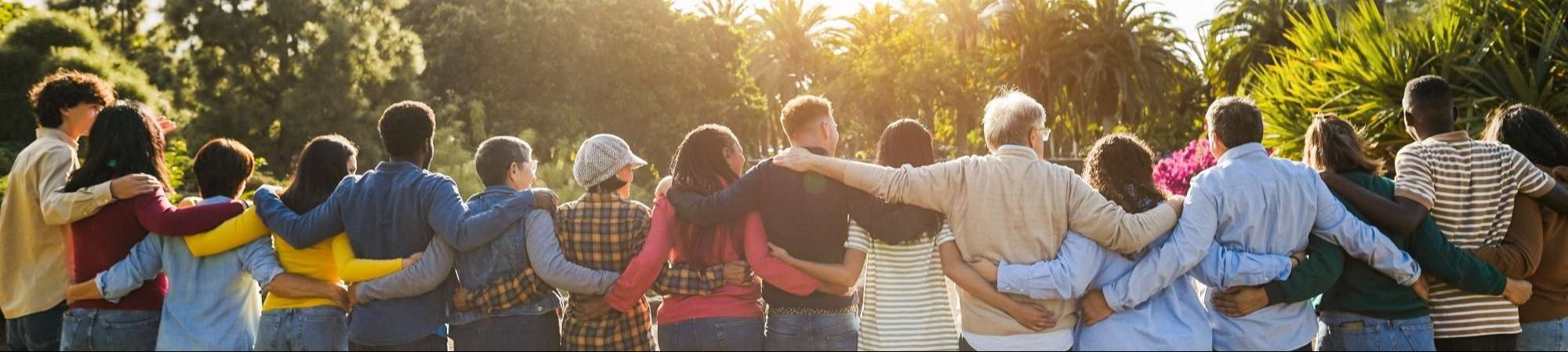 Three charity workers with the camera view looking from the bottom upward