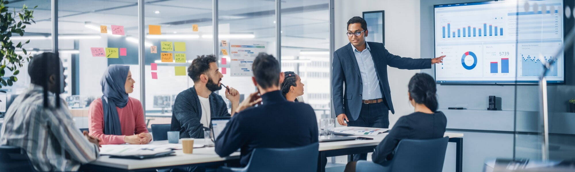 Recruitment boardroom with director discussing strategy to other employees 